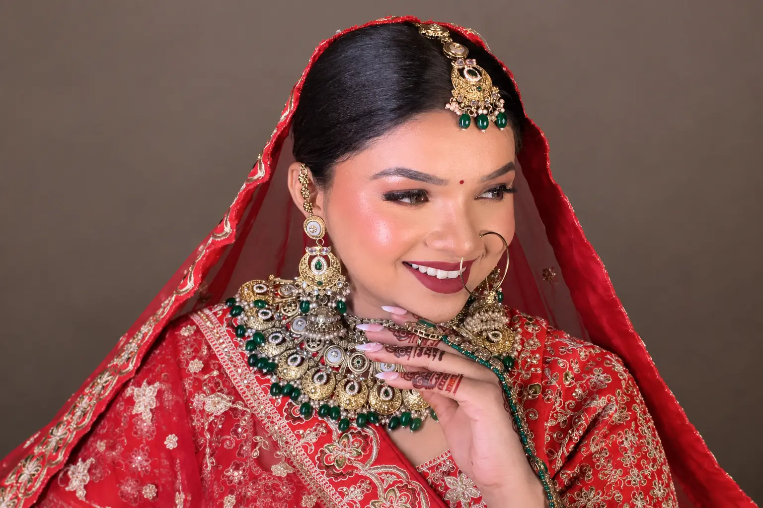 Makeup artist adding final touches to a bride's bridal makeup at Rush Salon, Surat