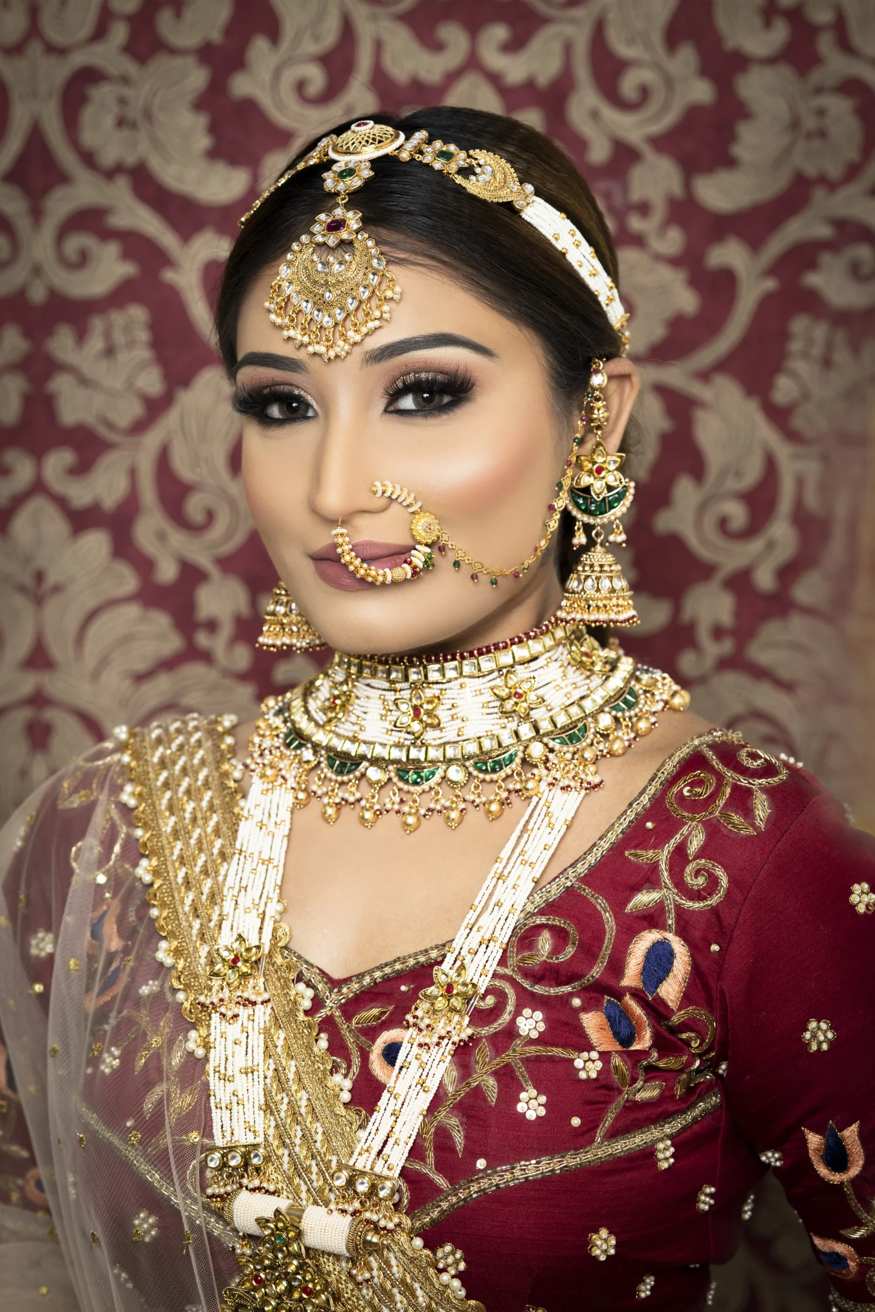 Bridal jewellery and flowers on a vanity at Rush Salon, Surat