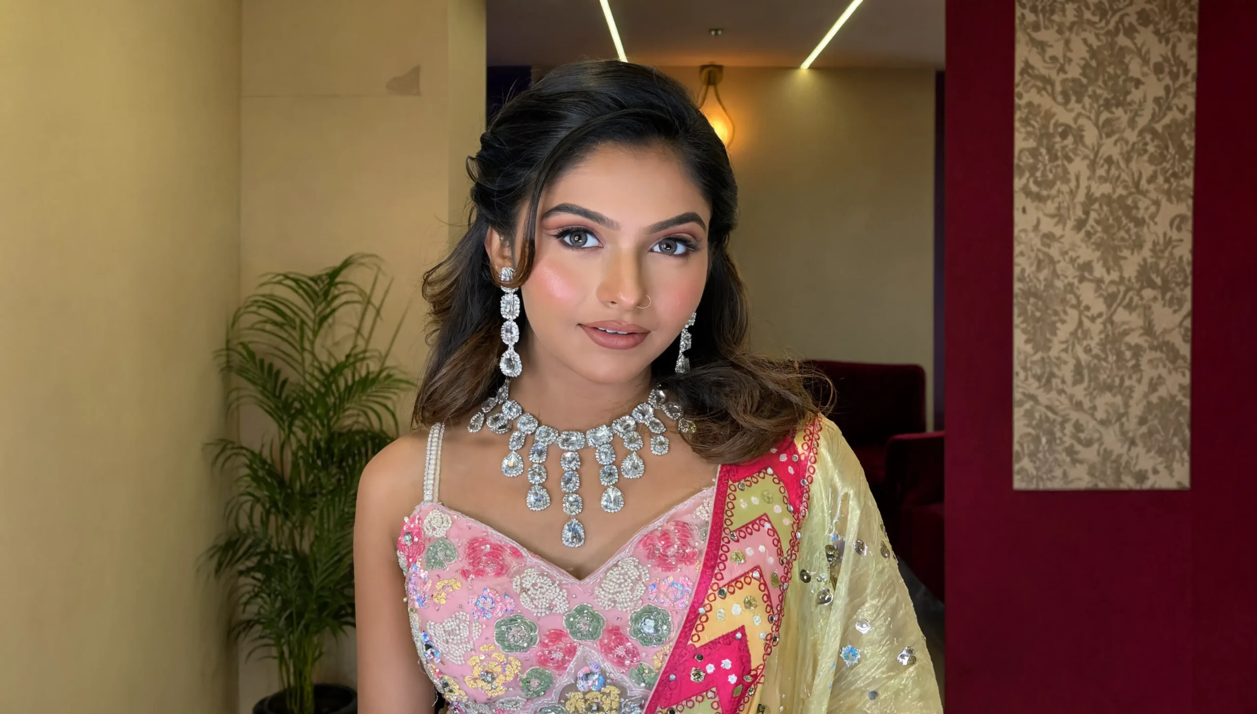 Women in completed hair and makeup looks by the team at Rush Salon, a unisex salon in Surat
